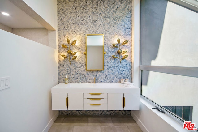 bathroom featuring a washtub and tile patterned floors