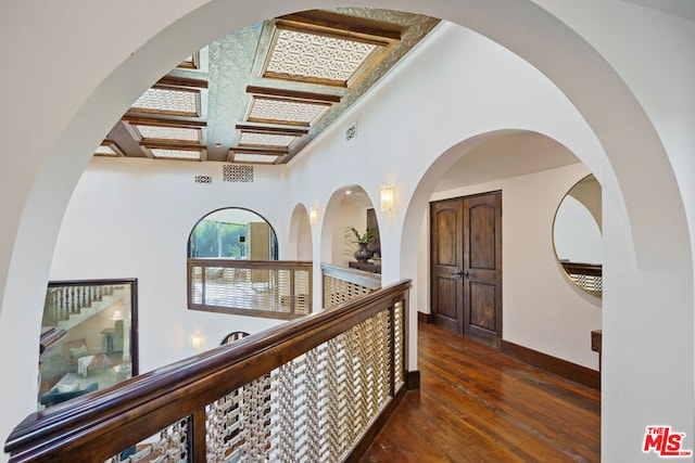 hallway with dark hardwood / wood-style flooring