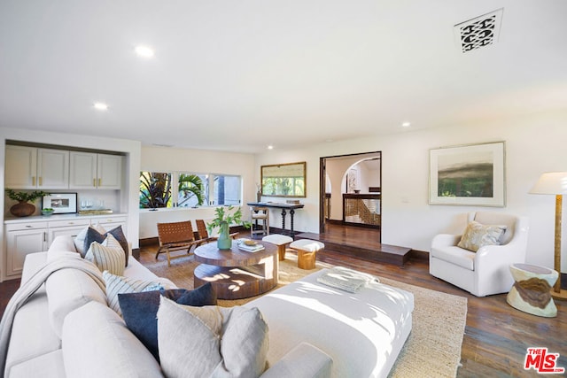 living room featuring dark hardwood / wood-style flooring