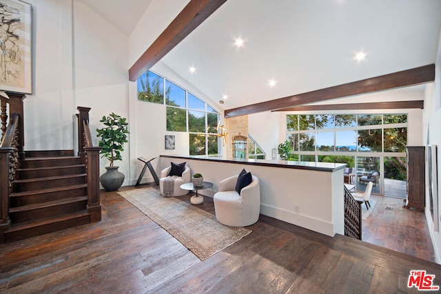 interior space with vaulted ceiling with beams, a wealth of natural light, and dark hardwood / wood-style floors