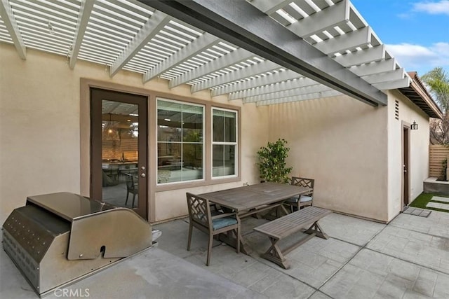 view of patio / terrace with area for grilling and a pergola