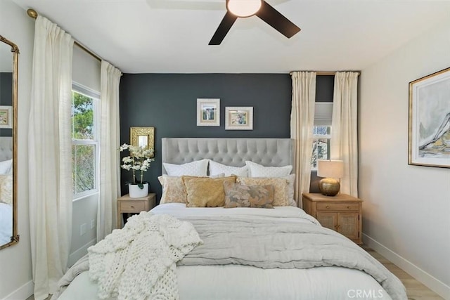 bedroom featuring hardwood / wood-style flooring and ceiling fan