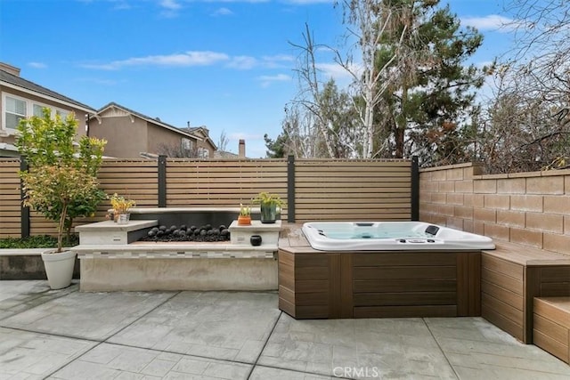 view of patio featuring an outdoor hot tub