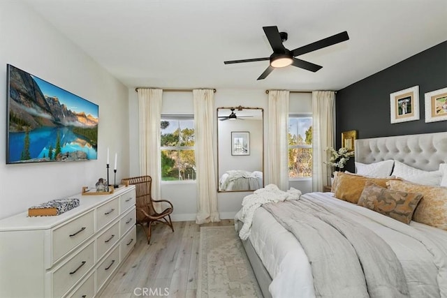 bedroom featuring ceiling fan and light hardwood / wood-style flooring