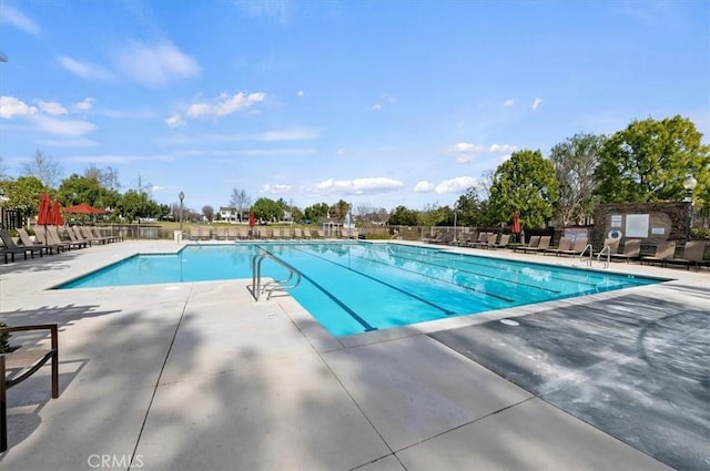 view of swimming pool featuring a patio area