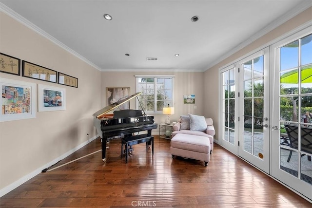 sitting room featuring crown molding, wood-type flooring, and french doors