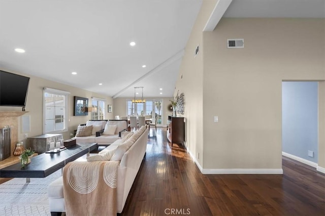 living room with dark wood-type flooring and high vaulted ceiling