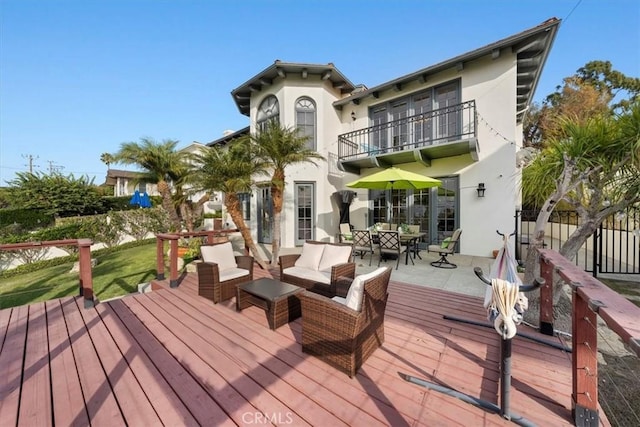 wooden deck featuring outdoor lounge area