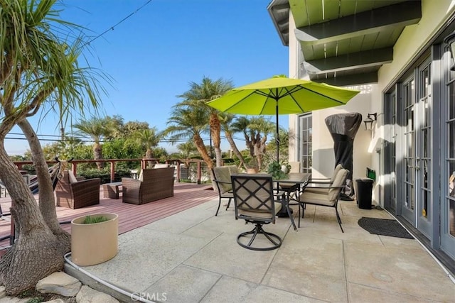 view of patio / terrace featuring french doors and a wooden deck