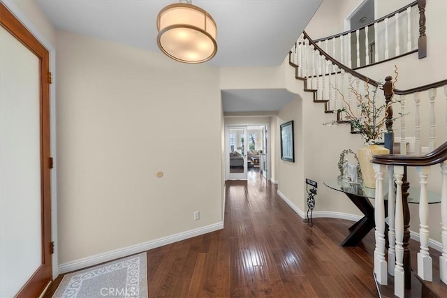 entrance foyer with dark hardwood / wood-style flooring