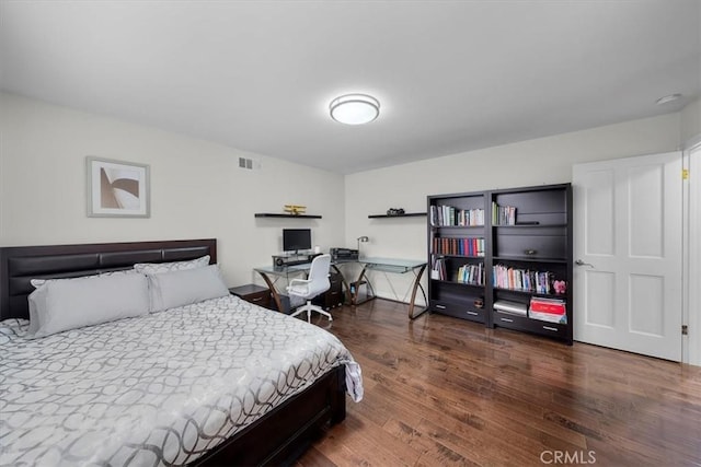 bedroom featuring dark wood-type flooring