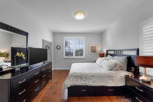 bedroom featuring dark hardwood / wood-style floors