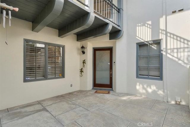 doorway to property with a patio