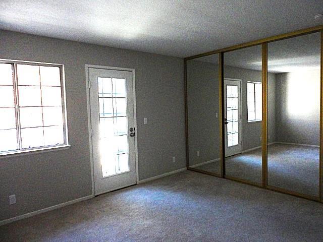 doorway featuring carpet flooring