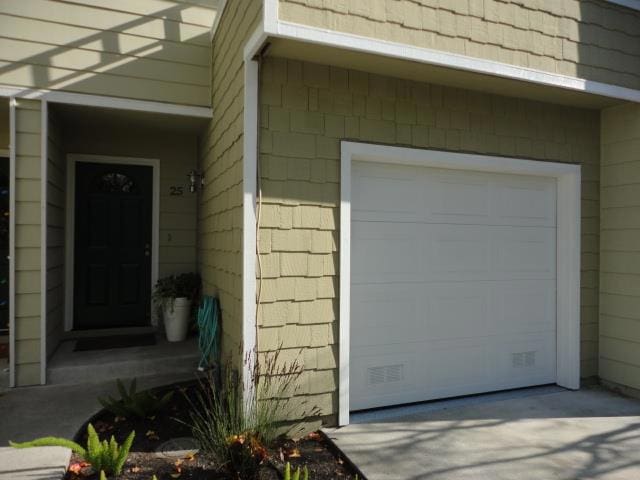 view of exterior entry featuring a garage