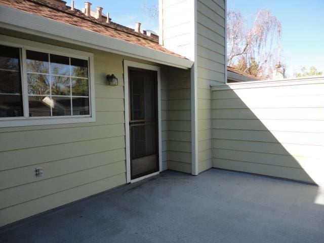 entrance to property with a patio