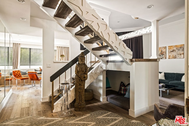 stairway with wood-type flooring