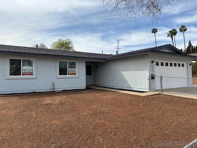 single story home with a garage