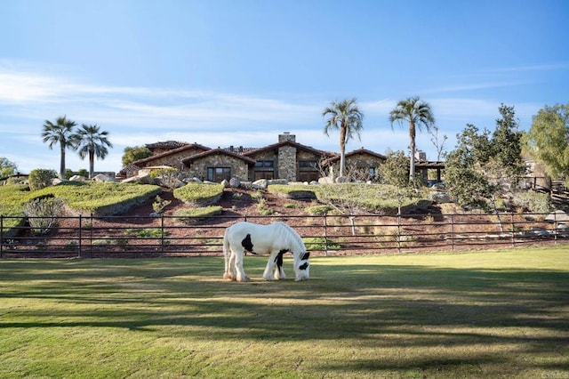 view of home's community with a lawn