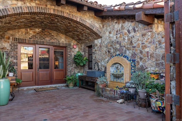 entrance to property featuring french doors