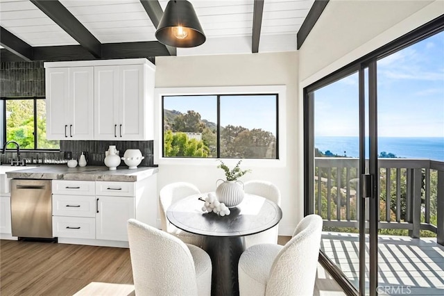 22332 Eagle Rock Way, Laguna Beach, CA 92651 - dining space with beam ceiling, light wood-type flooring, and a water view