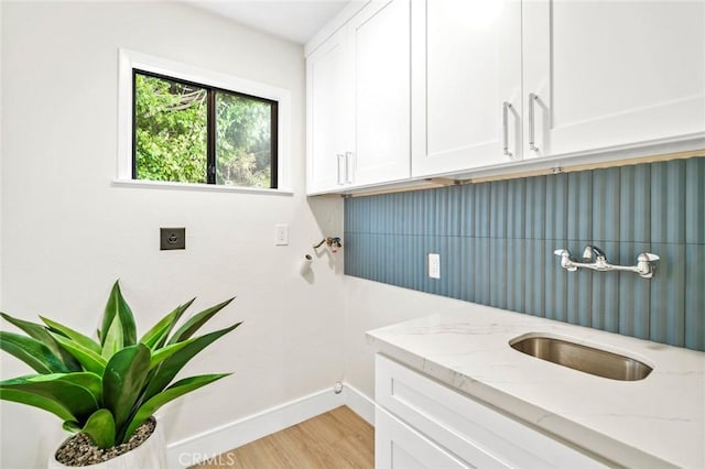 22332 Eagle Rock Way, Laguna Beach, CA 92651 - laundry room with cabinet space, light wood-style flooring, hookup for an electric dryer, and washer hookup