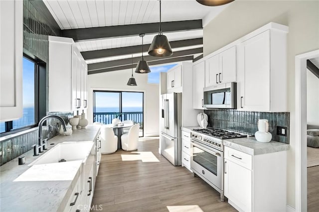 22332 Eagle Rock Way, Laguna Beach, CA 92651 - kitchen featuring high end appliances, tasteful backsplash, and plenty of natural light