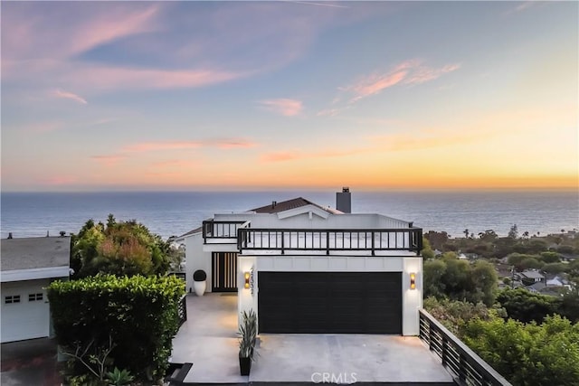 22332 Eagle Rock Way, Laguna Beach, CA 92651 - modern home featuring a balcony, a water view, driveway, and stucco siding