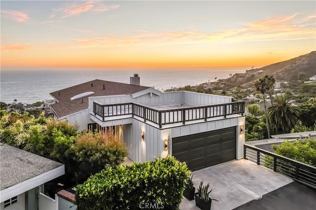 22332 Eagle Rock Way, Laguna Beach, CA 92651 - view of front of property featuring a water view, a balcony, and driveway