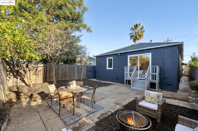 exterior space with a fire pit