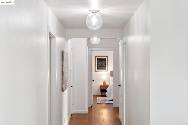 hallway with light hardwood / wood-style flooring