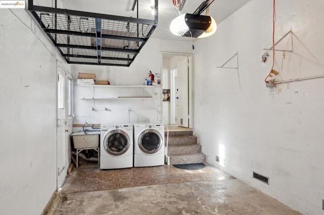 washroom featuring sink and washer and clothes dryer