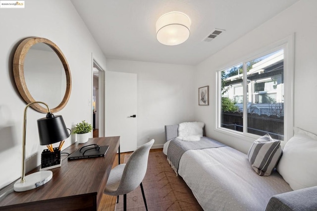 bedroom with wood-type flooring