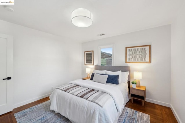 bedroom featuring dark hardwood / wood-style floors