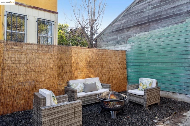 view of patio / terrace featuring an outdoor fire pit