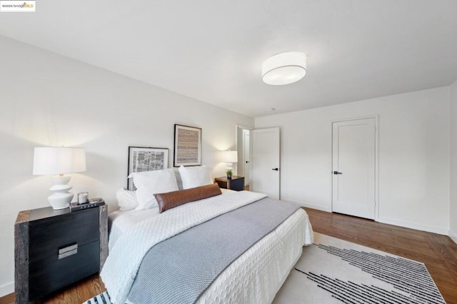 bedroom featuring dark wood-type flooring