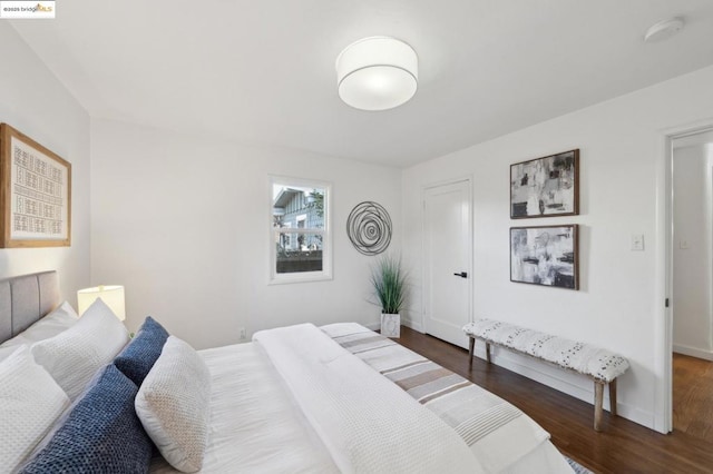 bedroom featuring dark wood-type flooring