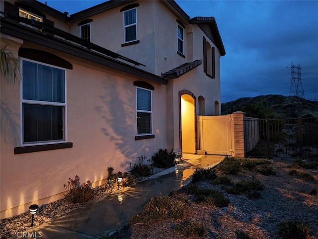 view of property exterior at dusk