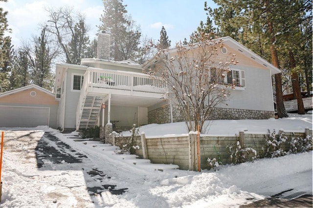 view of front property with an outbuilding and a garage