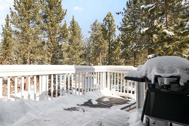 snow covered deck with grilling area