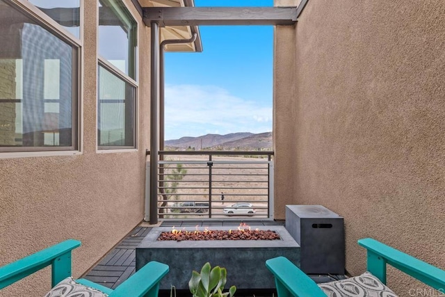 16750 Coyote Bush Dr Unit 107, San Diego, CA 92127 - view of patio with a balcony, a fire pit, and a mountain view