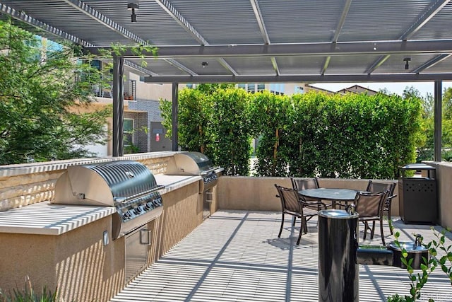 16750 Coyote Bush Dr Unit 107, San Diego, CA 92127 - view of patio featuring a pergola, outdoor dining space, an outdoor kitchen, and area for grilling