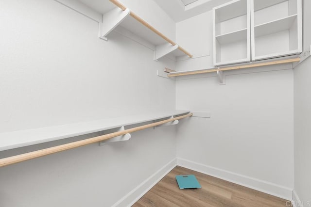 16750 Coyote Bush Dr Unit 107, San Diego, CA 92127 - walk in closet with wood finished floors