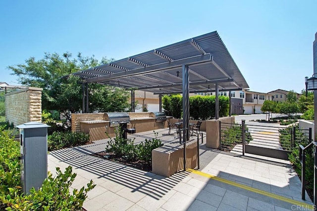 16750 Coyote Bush Dr Unit 107, San Diego, CA 92127 - view of patio with area for grilling and a pergola