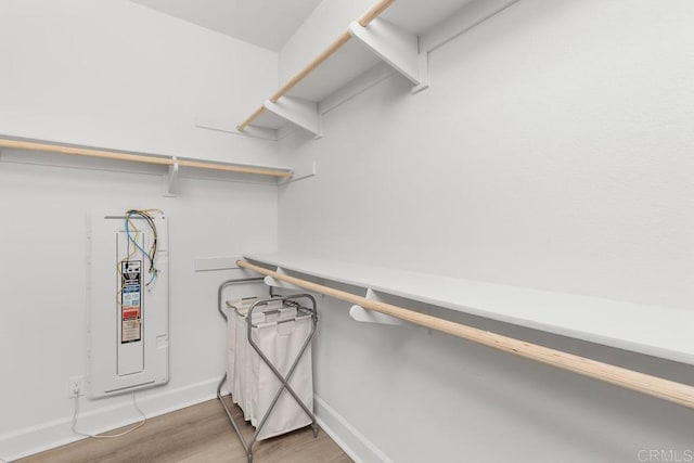 16750 Coyote Bush Dr Unit 107, San Diego, CA 92127 - walk in closet featuring light wood-type flooring