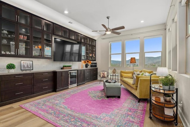 16750 Coyote Bush Dr Unit 107, San Diego, CA 92127 - living room featuring recessed lighting, beverage cooler, visible vents, light wood-style flooring, and ceiling fan