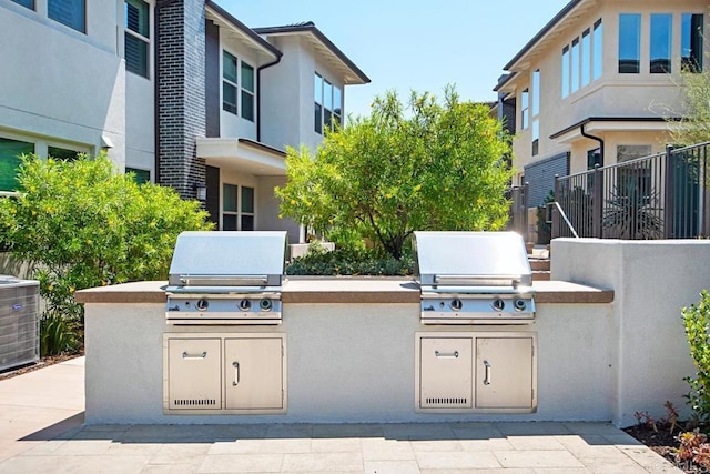 16750 Coyote Bush Dr Unit 107, San Diego, CA 92127 - view of patio with cooling unit, an outdoor kitchen, and area for grilling