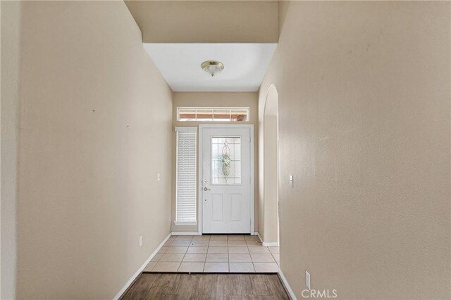 entryway with light tile patterned floors