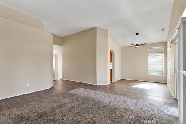 11262 Country Club Dr, Apple Valley, CA 92308 - empty room featuring wood finished floors, visible vents, lofted ceiling, arched walkways, and ceiling fan