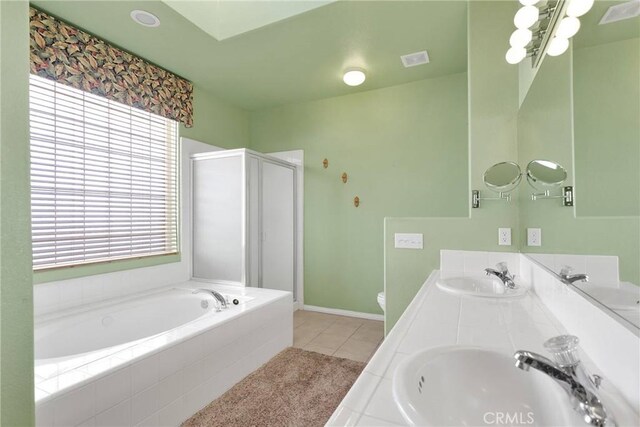 full bathroom featuring vanity, tile patterned floors, plus walk in shower, and toilet